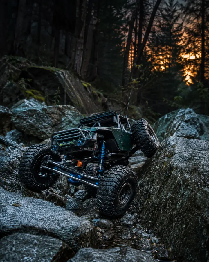 RC rock crawler climbing a steep rock face